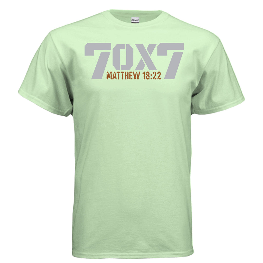 Mint green Christian t-shirt with bold gray text reading '70 x 7' and scripture reference 'Matthew 18:22' in orange beneath it