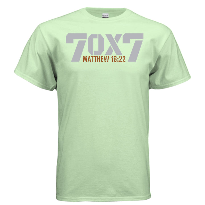 Mint green Christian t-shirt with bold gray text reading '70 x 7' and scripture reference 'Matthew 18:22' in orange beneath it