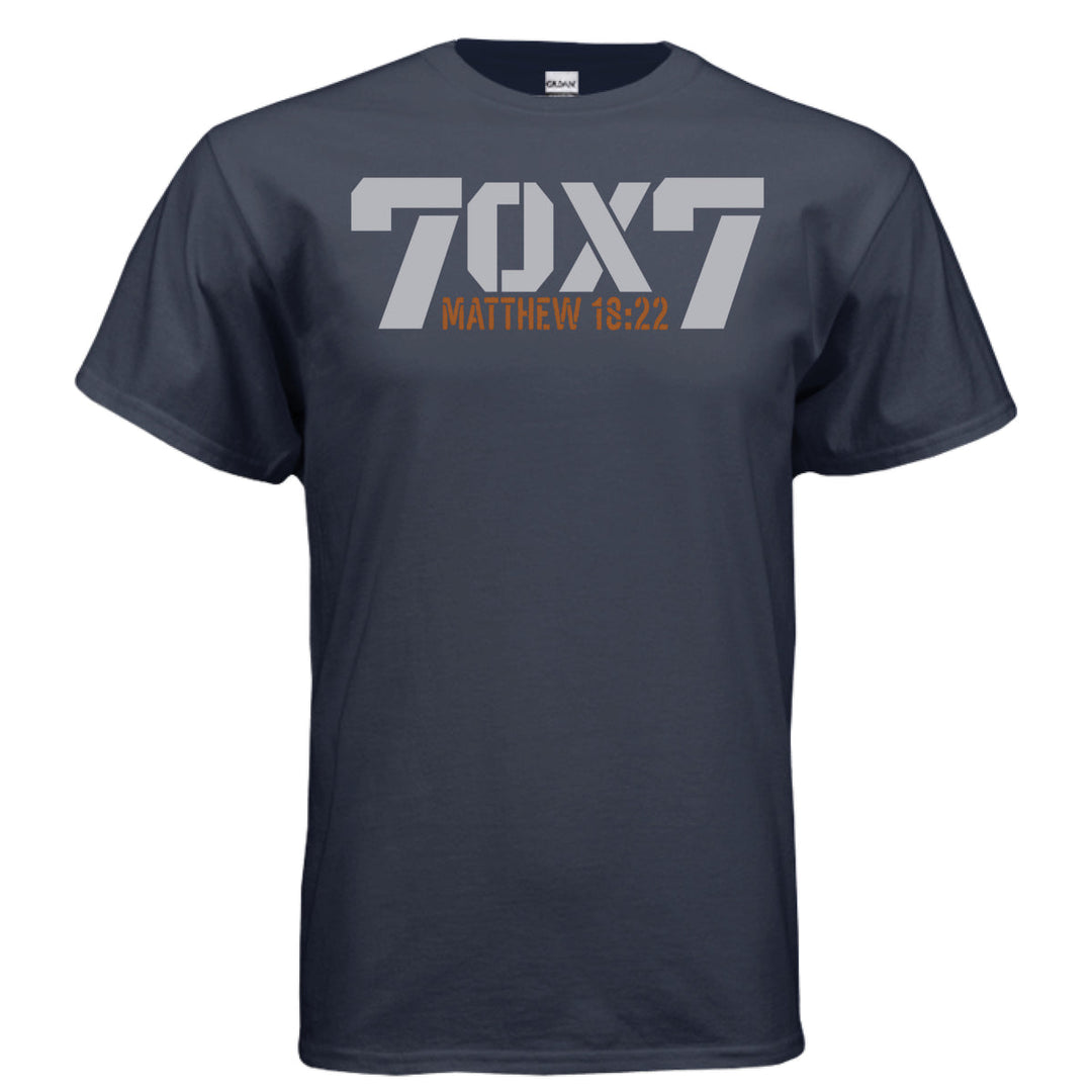 Navy Christian t-shirt with bold gray text reading '70 x 7' and scripture reference 'Matthew 18:22' in orange beneath it