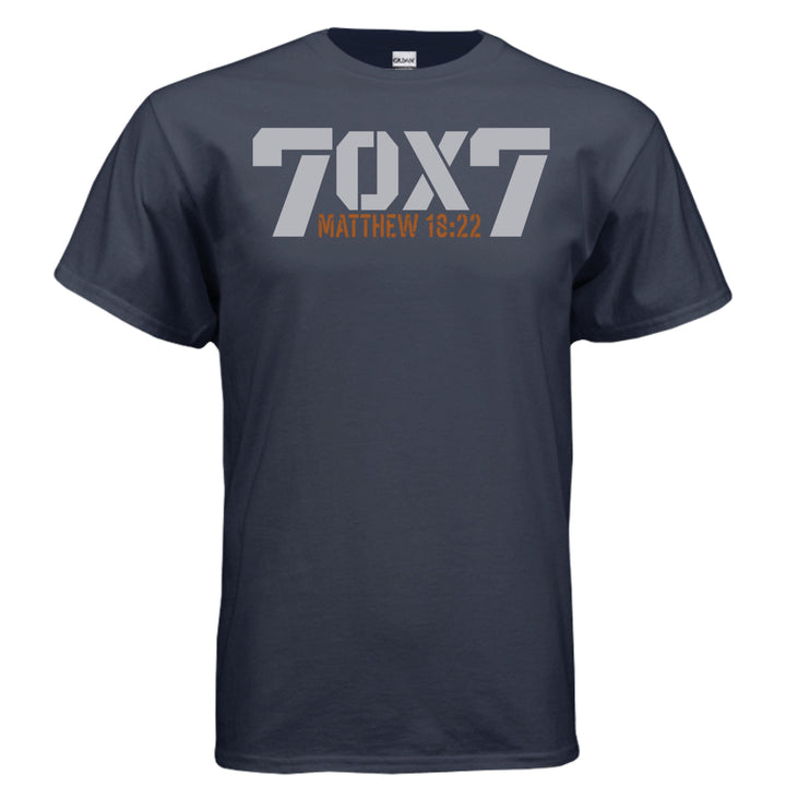 Navy Christian t-shirt with bold gray text reading '70 x 7' and scripture reference 'Matthew 18:22' in orange beneath it