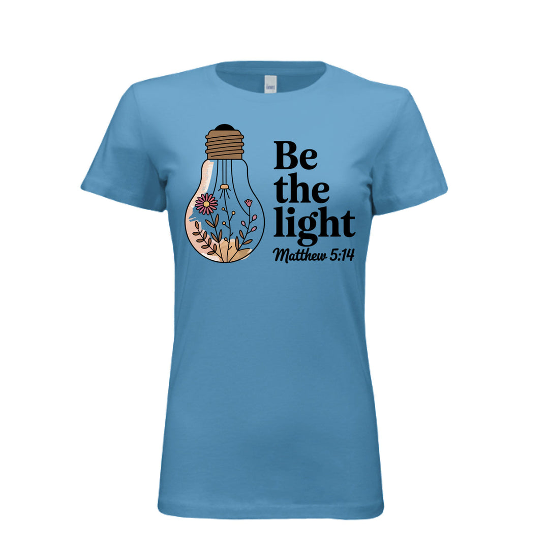 Women's fitted tee in aqua with a floral light bulb graphic and the words “Be the light – Matthew 5:14” in bold and script fonts.