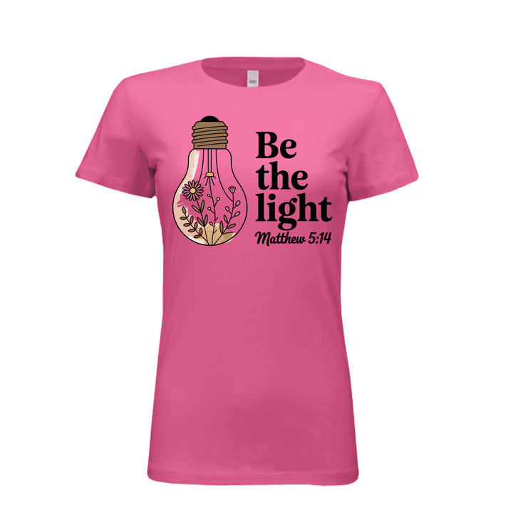 Women's fitted tee in berry with a floral light bulb graphic and the words “Be the light – Matthew 5:14” in bold and script fonts.