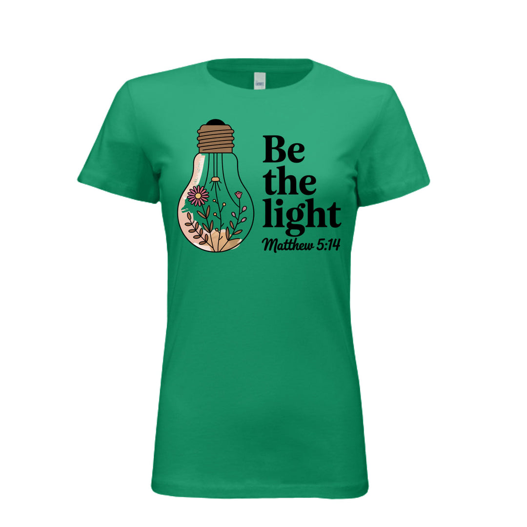 Women's fitted tee in kelly with a floral light bulb graphic and the words “Be the light – Matthew 5:14” in bold and script fonts.