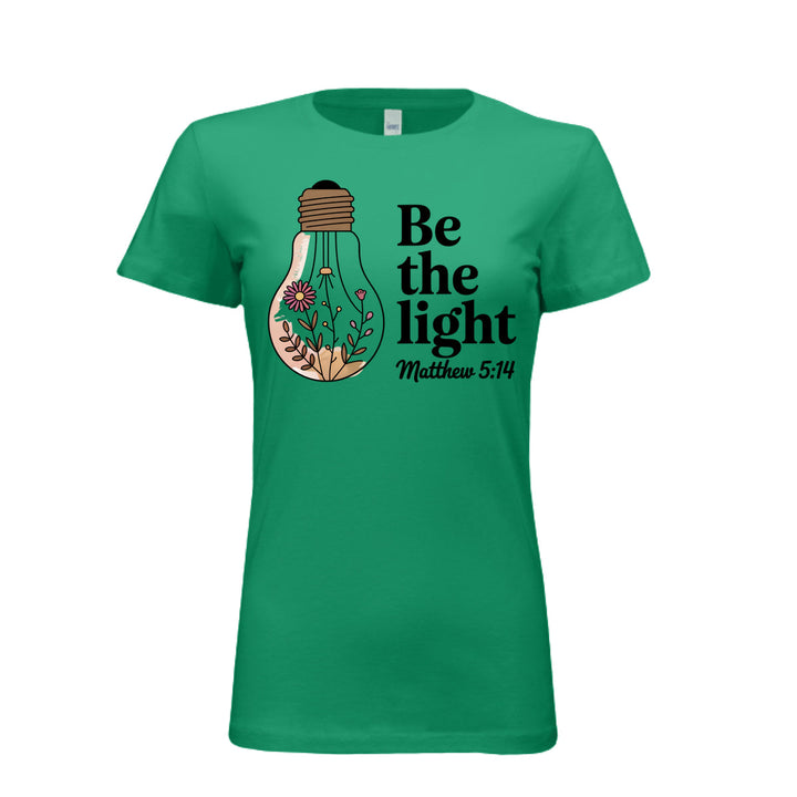 Women's fitted tee in kelly with a floral light bulb graphic and the words “Be the light – Matthew 5:14” in bold and script fonts.