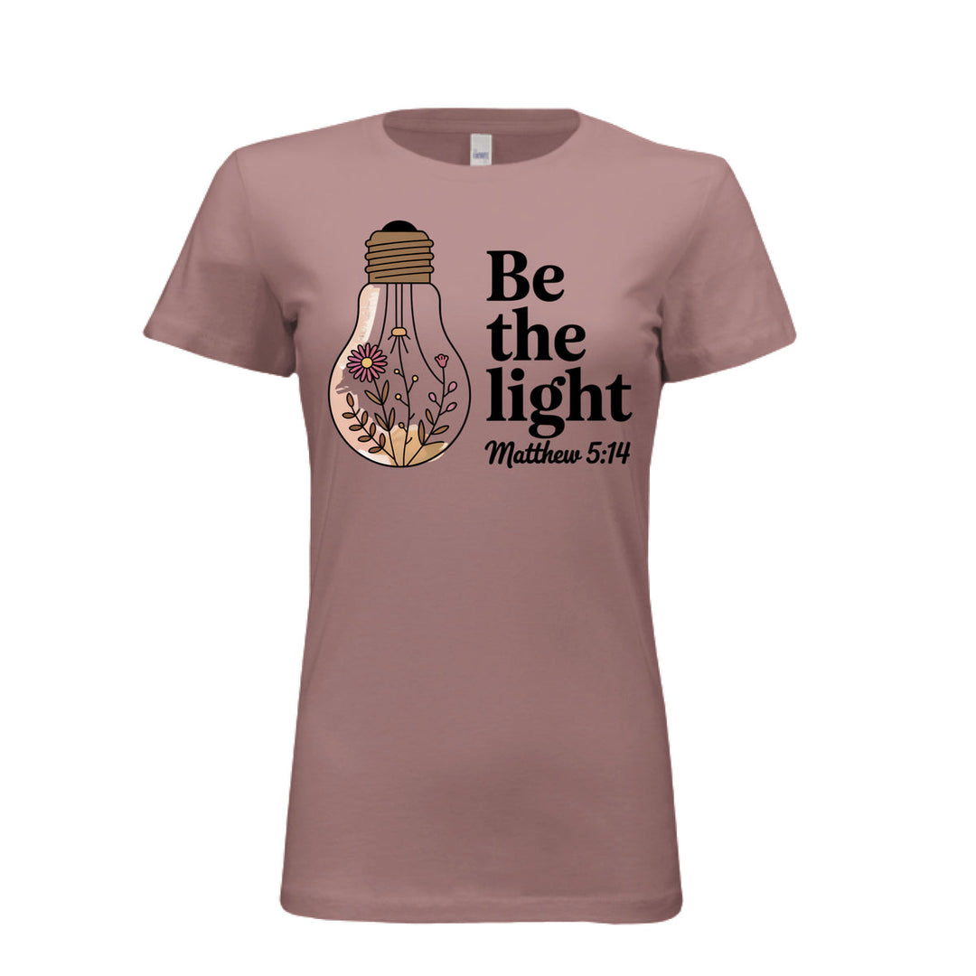 Women's fitted tee in mauve with a floral light bulb graphic and the words “Be the light – Matthew 5:14” in bold and script fonts.