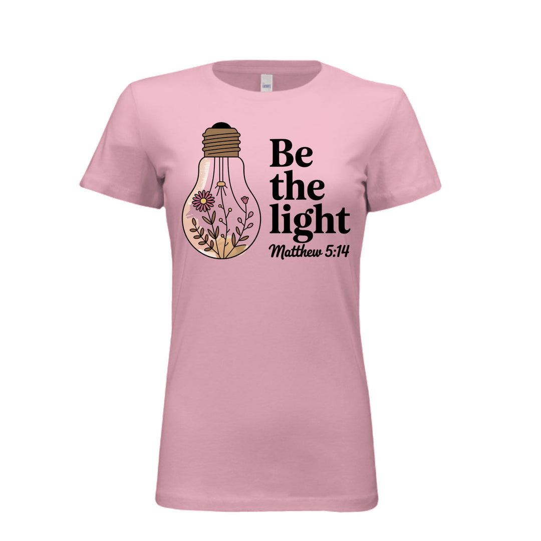 Women's fitted tee in pink with a floral light bulb graphic and the words “Be the light – Matthew 5:14” in bold and script fonts.