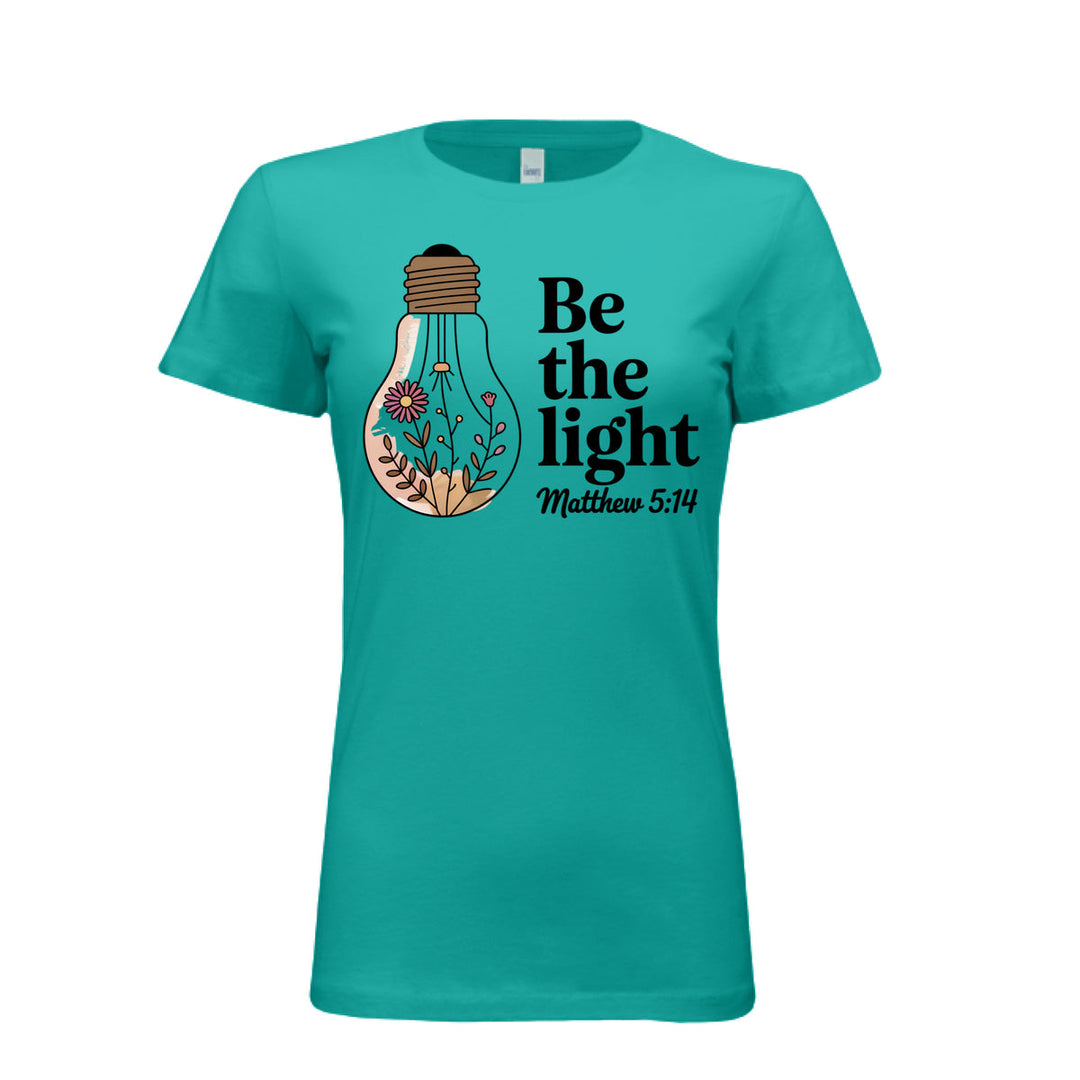 Women's fitted tee in teal with a floral light bulb graphic and the words “Be the light – Matthew 5:14” in bold and script fonts.