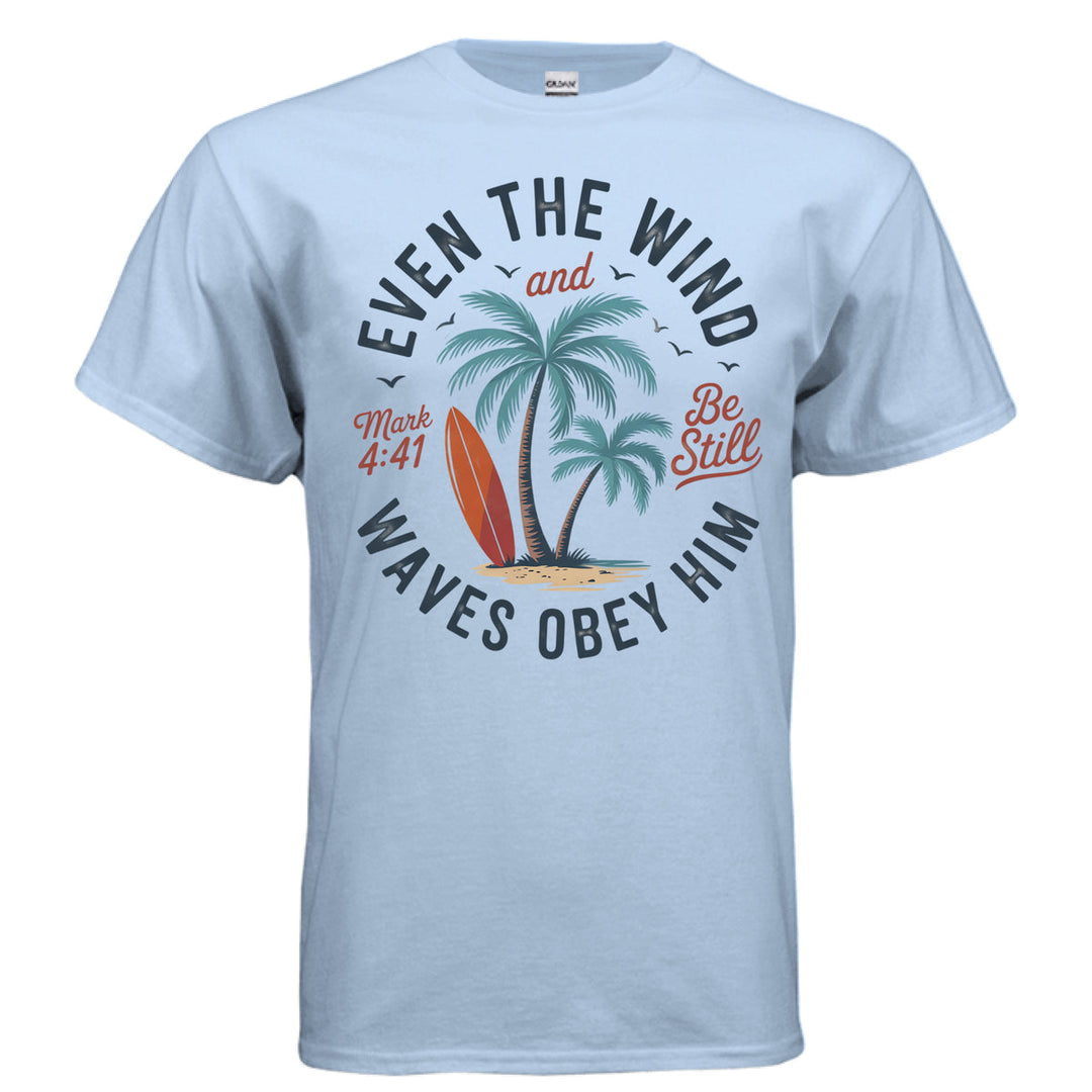 Light blue Christian t-shirt with palm trees, a red surfboard, and the words ‘Even the wind and waves obey Him – Mark 4:41’ and ‘Be Still’