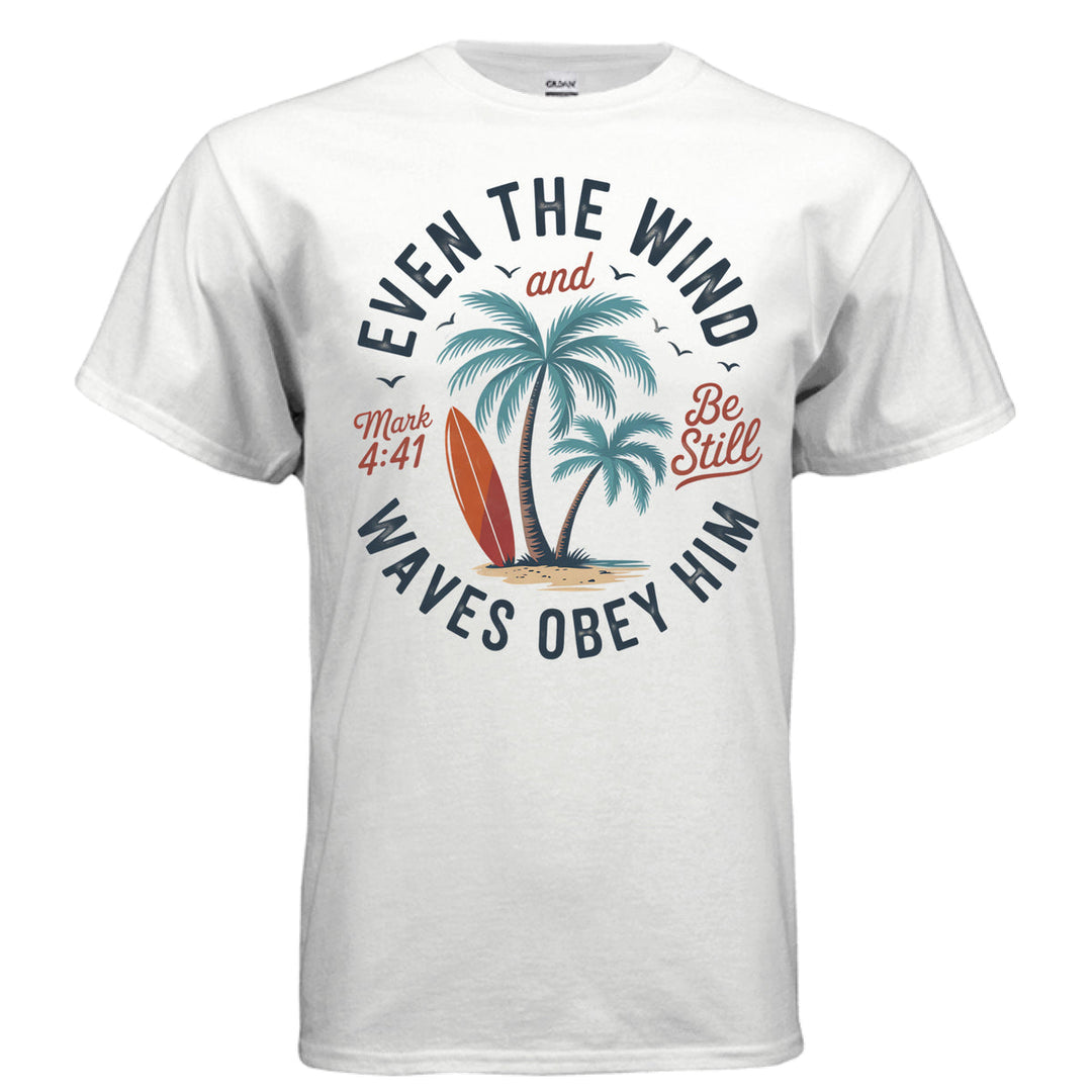 White Christian t-shirt with palm trees, a red surfboard, and the words ‘Even the wind and waves obey Him – Mark 4:41’ and ‘Be Still’