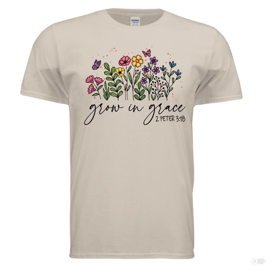 Sand shirt featuring hand-drawn colorful flowers and butterflies, with “Grow in Grace” and 2 Peter 3:18 written in script across the front.