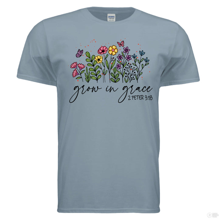 Stone Blue shirt featuring hand-drawn colorful flowers and butterflies, with “Grow in Grace” and 2 Peter 3:18 written in script across the front.