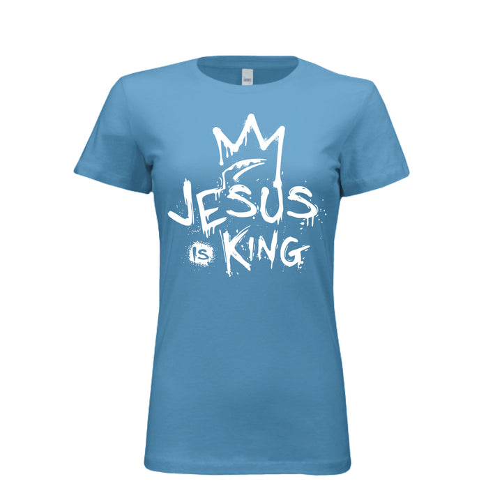 Aqua women’s fitted t-shirt with bold white graffiti-style design reading “Jesus Is King” under a crown. Urban faith statement piece.