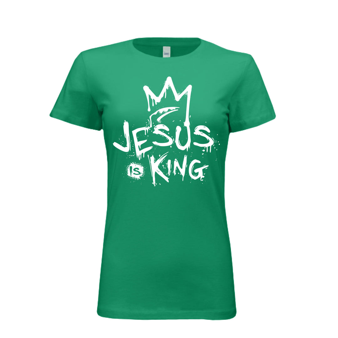 Kelly women’s fitted t-shirt with bold white graffiti-style design reading “Jesus Is King” under a crown. Urban faith statement piece.