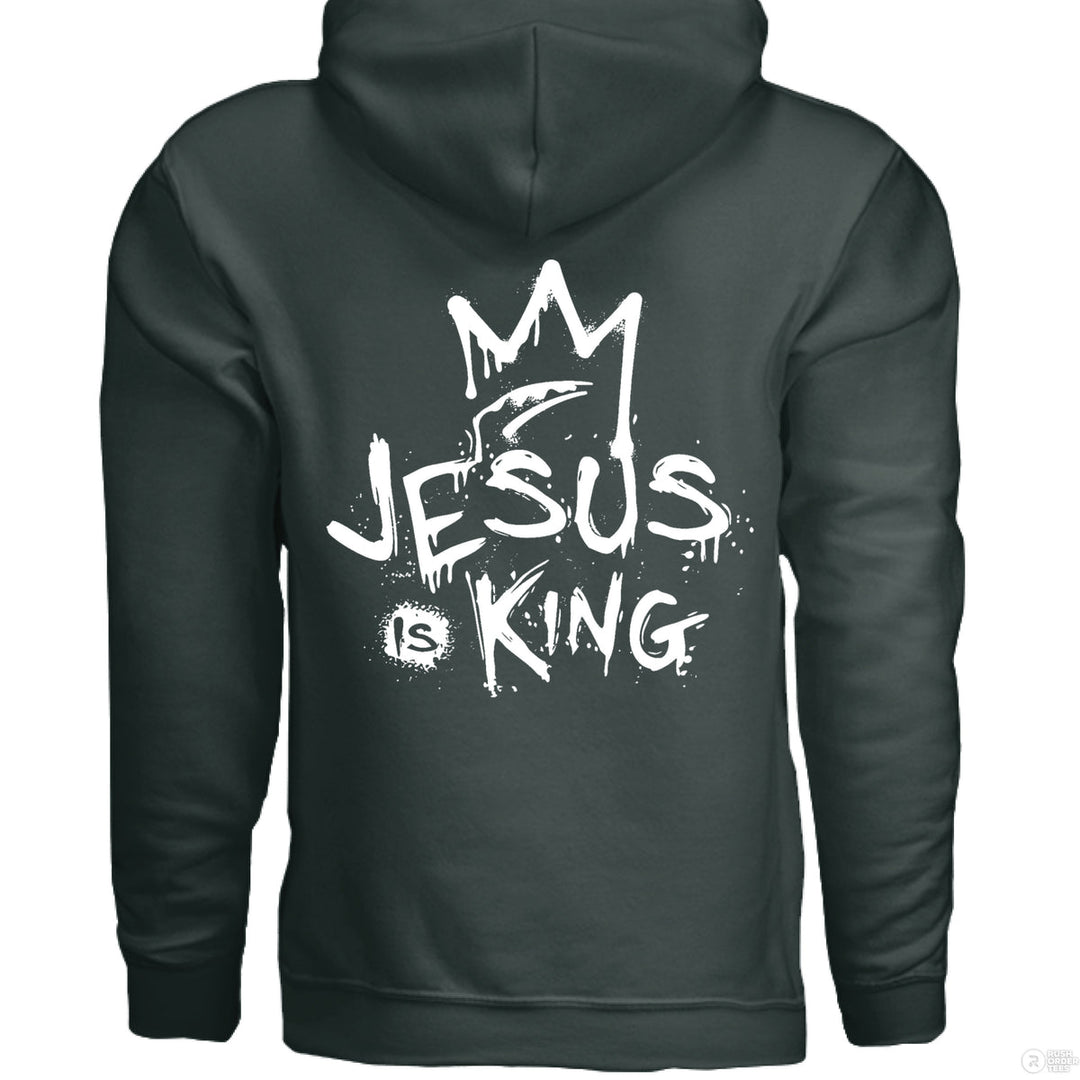 Forest green Christian hoodie with front spray-paint cross and bold back graffiti-style text reading ‘Jesus is King’ with crown design