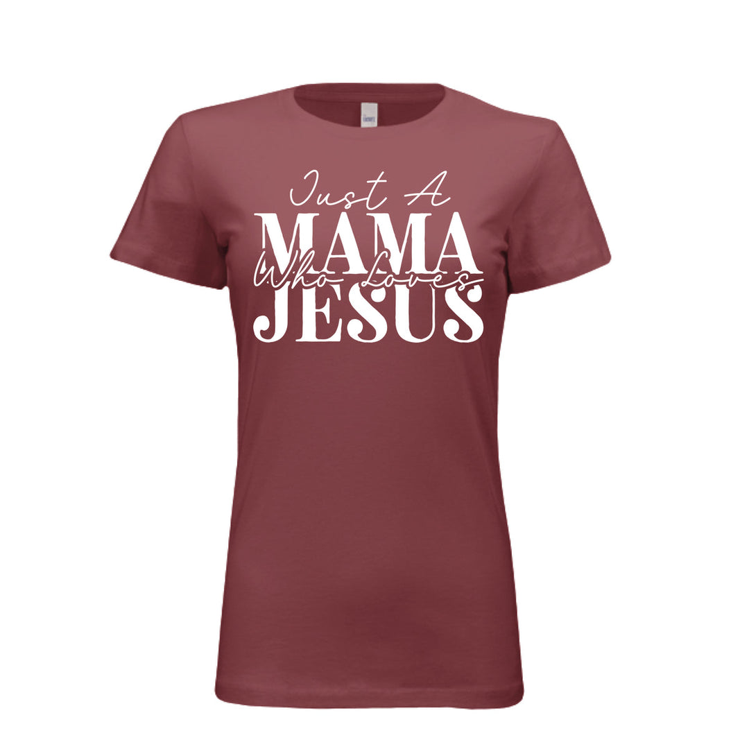 Women's maroon t-shirt with white text reading "Just A Mama Who Loves Jesus" in bold and script fonts—a bold statement of faith and motherhood.