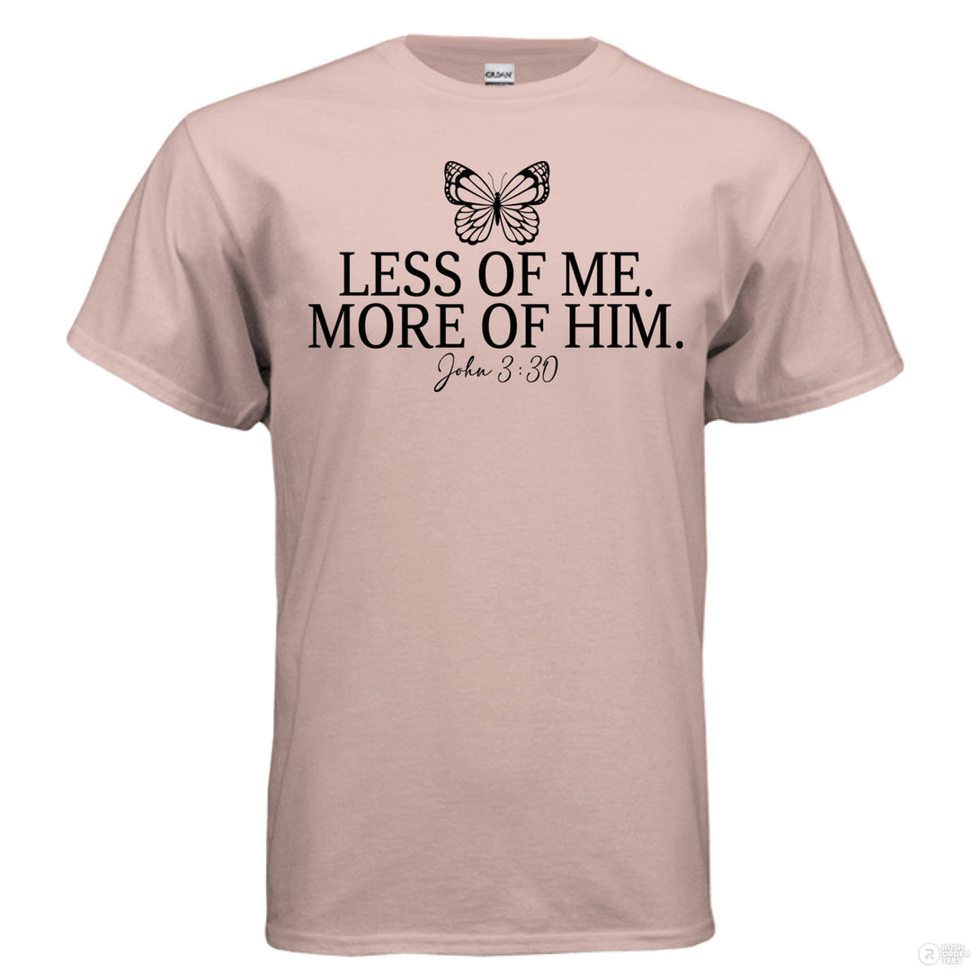 Dusty rose Christian t-shirt with a butterfly icon and the text ‘Less of me. More of Him.’ in bold script, referencing John 3:30
