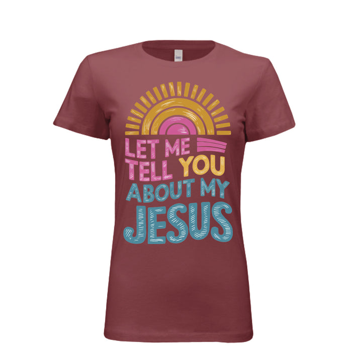 Women's fitted tee in maroon with colorful retro sunrise design and bold text reading “Let Me Tell You About My Jesus.
