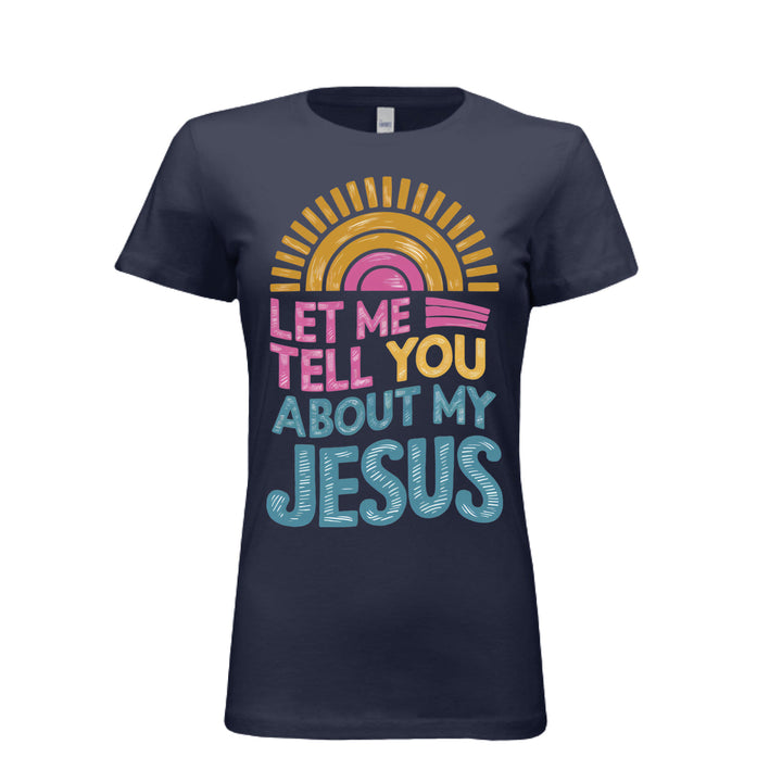 Women's fitted tee in navy with colorful retro sunrise design and bold text reading “Let Me Tell You About My Jesus.