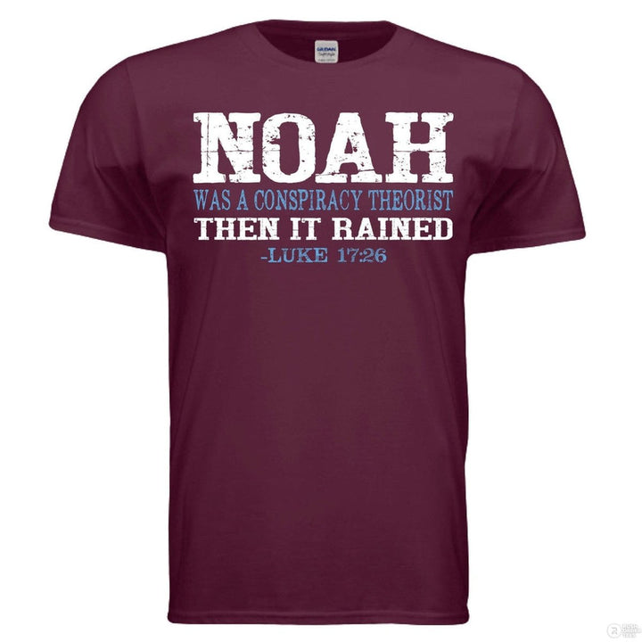 Maroon shirt with bold distressed text: “NOAH was a conspiracy theorist THEN IT RAINED – Luke 17:26” in white and blue, referencing biblical faith and truth