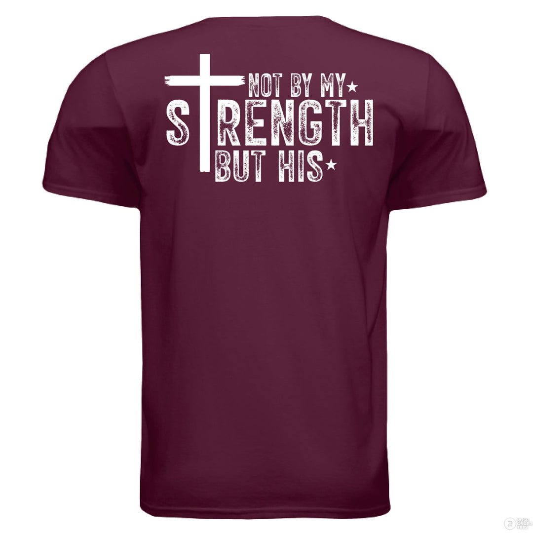 Maroon Christian t-shirt with bold white text reading ‘Not by my strength but His’ and a large cross forming the letter T in STRENGTH