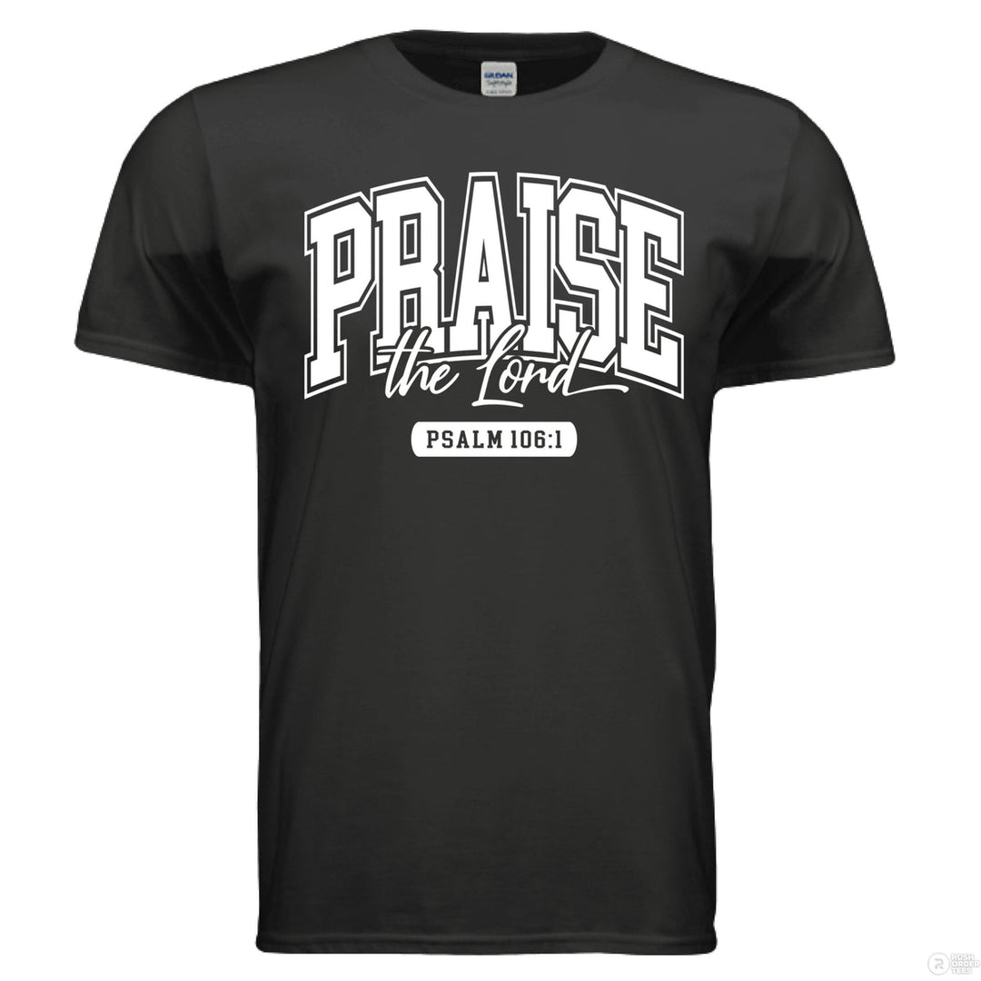 Black Christian t-shirt with bold varsity-style text reading “Praise the Lord” and Psalm 106:1 beneath in a white block print