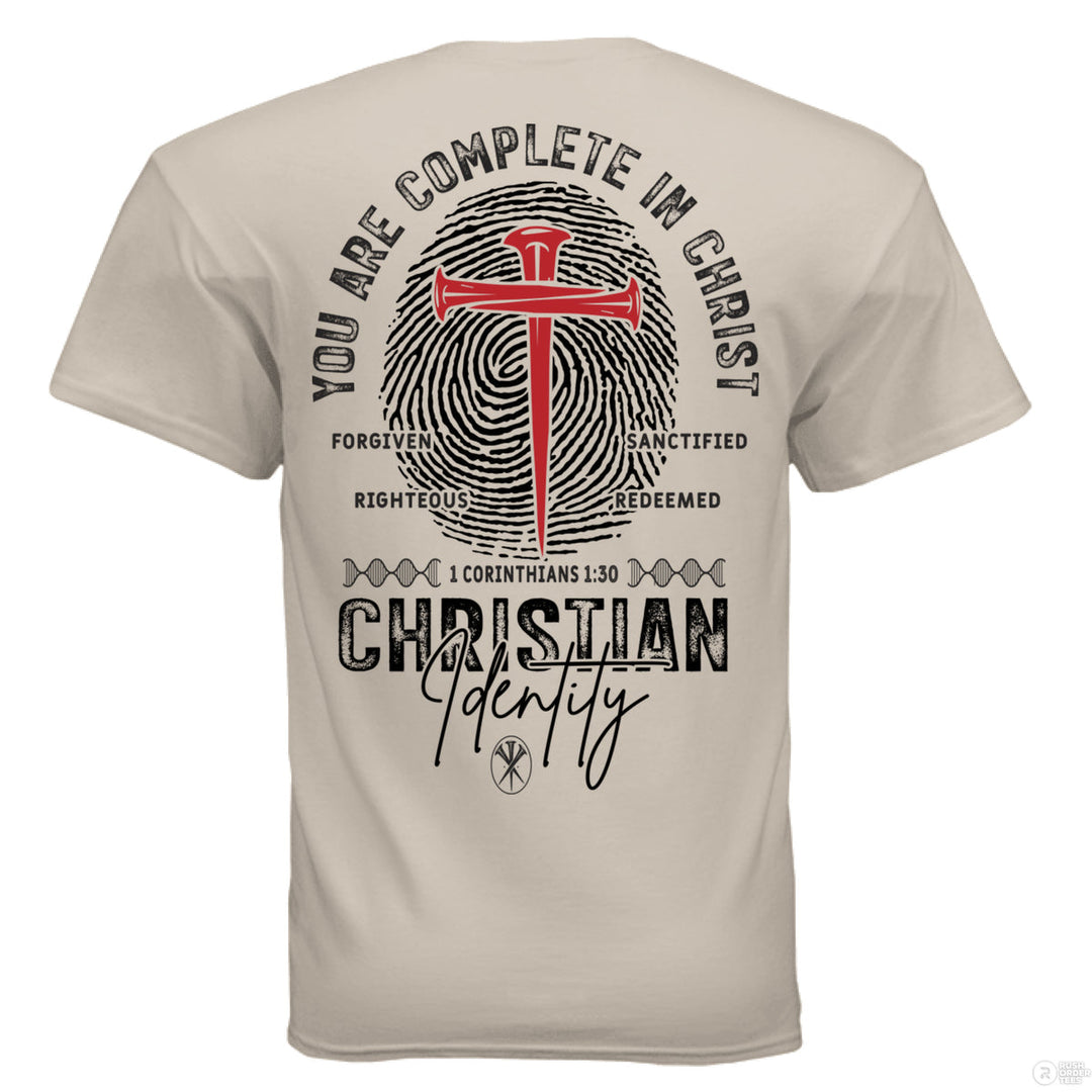 Sand Christian t-shirt with a fingerprint and red cross graphic, reading ‘You are complete in Christ’ and ‘Christian Identity’ – Colossians 2:10